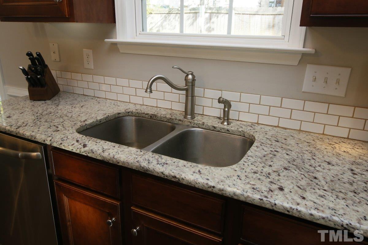 9212 Pennythorne Court Raleigh, NC 27615 - Photo 16 of 25 a close view of sink and tap