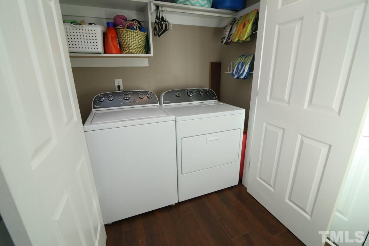 9212 Pennythorne Court Raleigh, NC 27615 - Photo 18 of 25 a utility room with dryer and washer