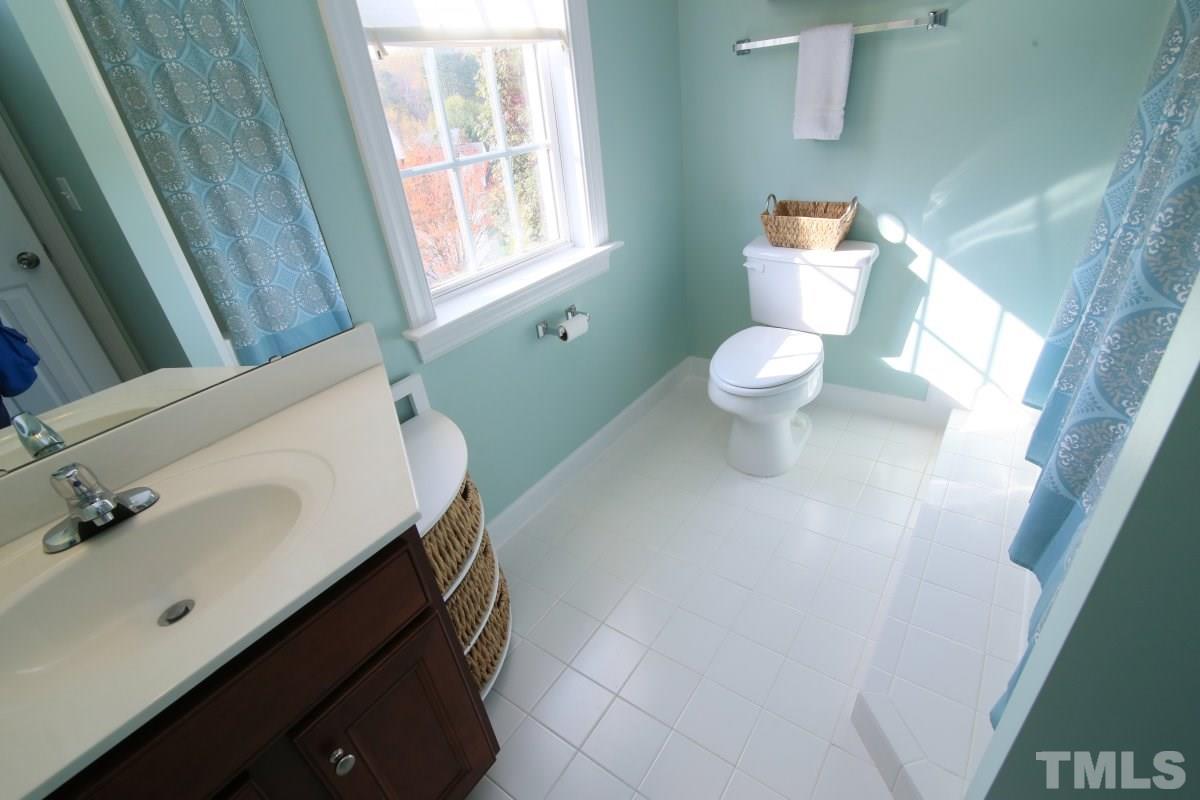 9212 Pennythorne Court Raleigh, NC 27615 - Photo 25 of 25 a bathroom with a sink and a toilet