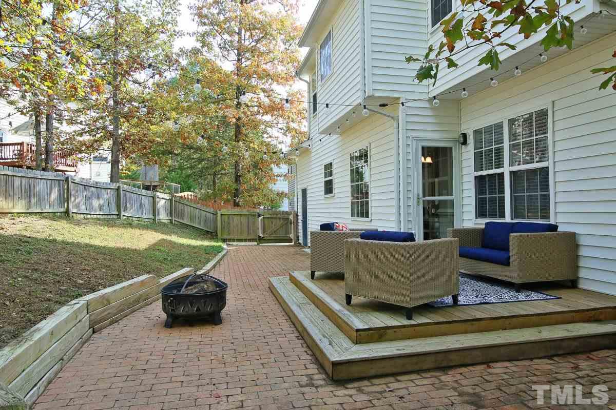 9212 Pennythorne Court Raleigh, NC 27615 - Photo 4 of 25 a view of house with backyard and outdoor seating