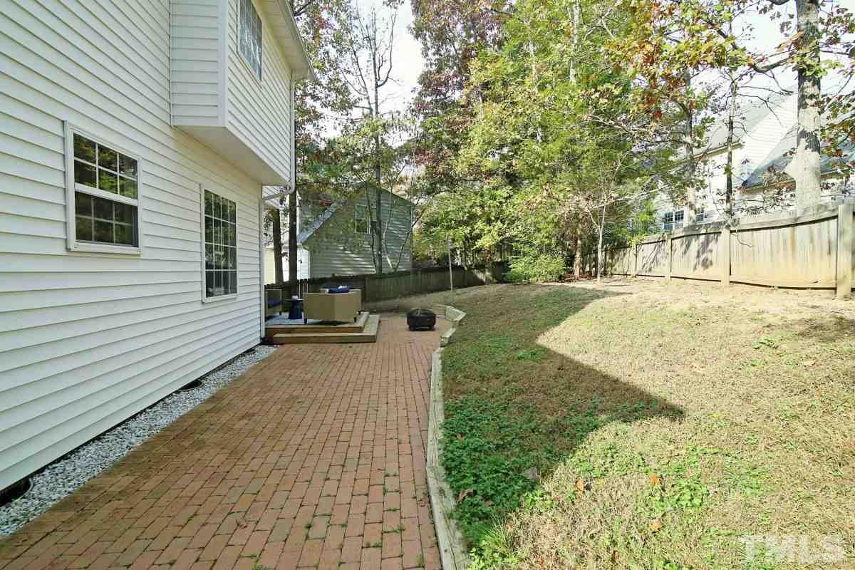 9212 Pennythorne Court Raleigh, NC 27615 - Photo 6 of 25 a view of a backyard of the house