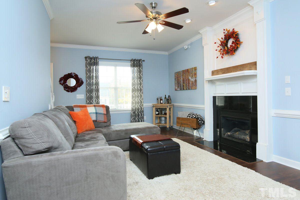 9212 Pennythorne Court Raleigh, NC 27615 - Photo 9 of 25 a living room with furniture and a fireplace