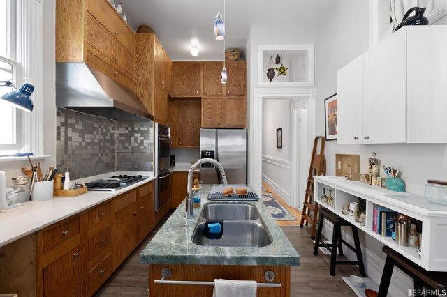 a living room with furniture and a book shelf