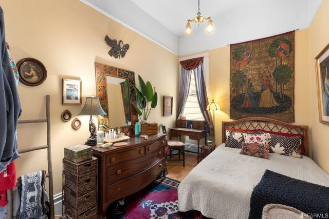 a bedroom with a bed and a dresser