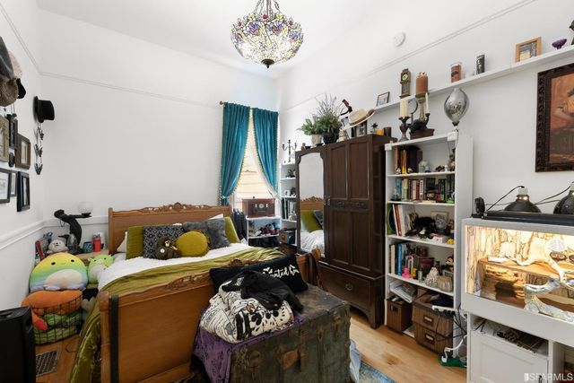 a bed room with a bed and a book shelf