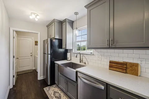 a view of a livingroom with furniture and wooden floor