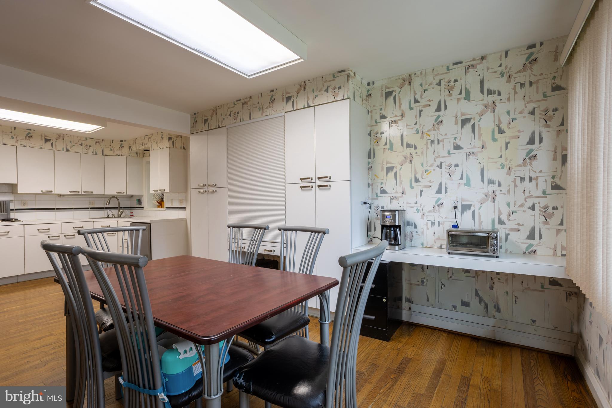 3215 Northbrook Road Baltimore, MD 21208 - Photo 15 of 50 a view of a dining room with furniture and wooden floor