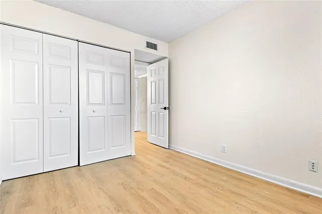 a view of a balcony with wooden fence and floor