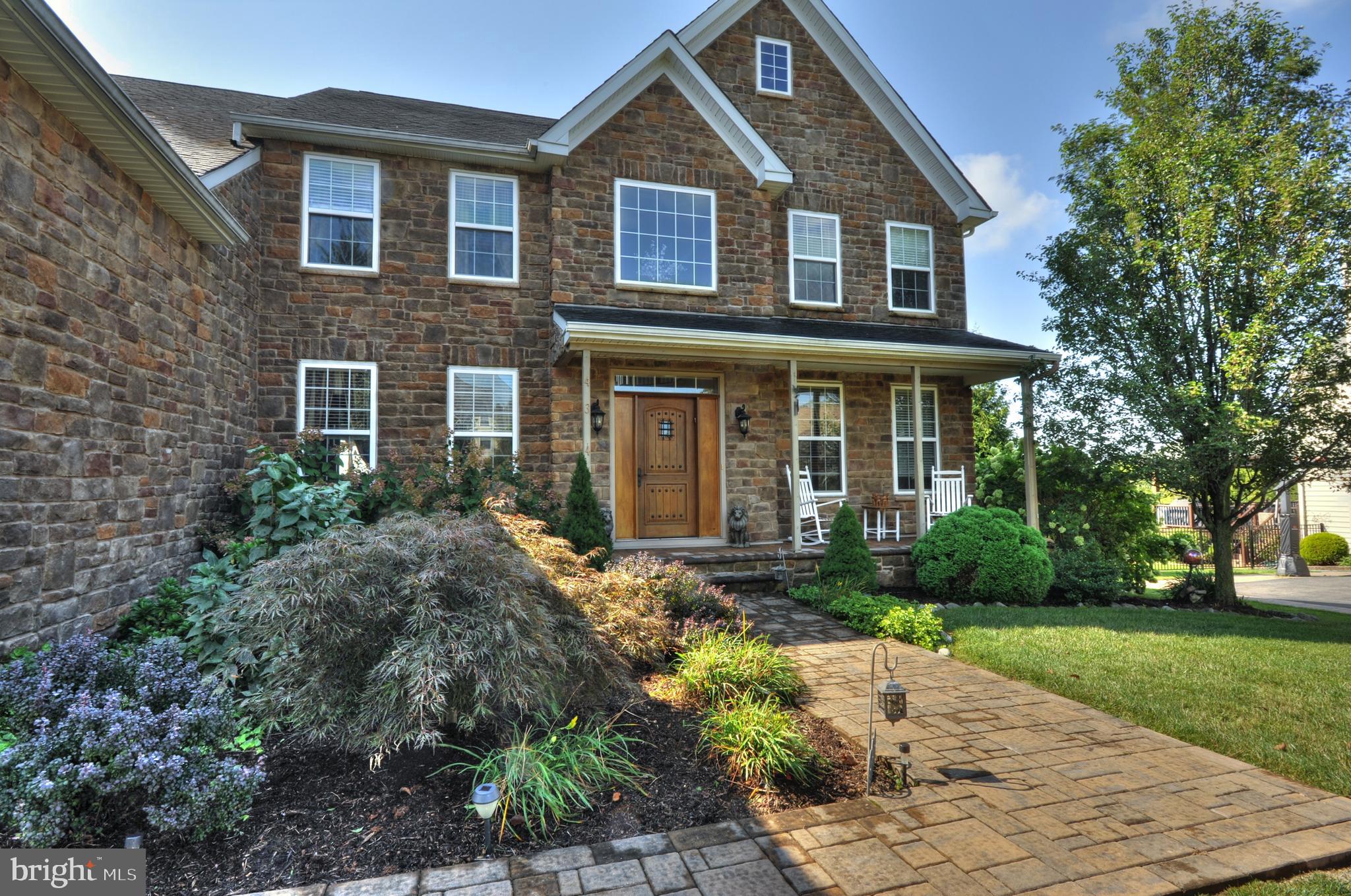 434 Hoffman Road Harleysville, PA 19438 - Photo 2 of 46 a front view of a house with garden