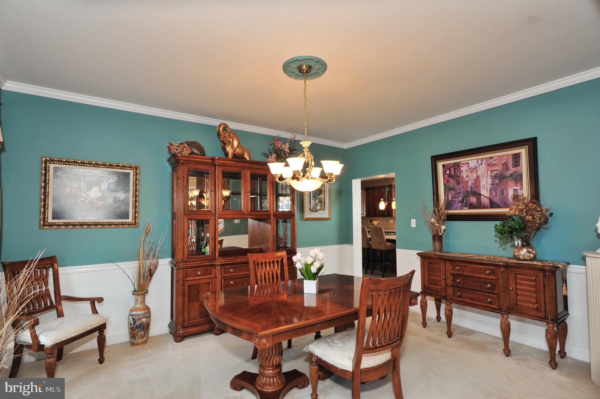 434 Hoffman Road Harleysville, PA 19438 - Photo 14 of 46 a living room with furniture a chandelier and a dining table