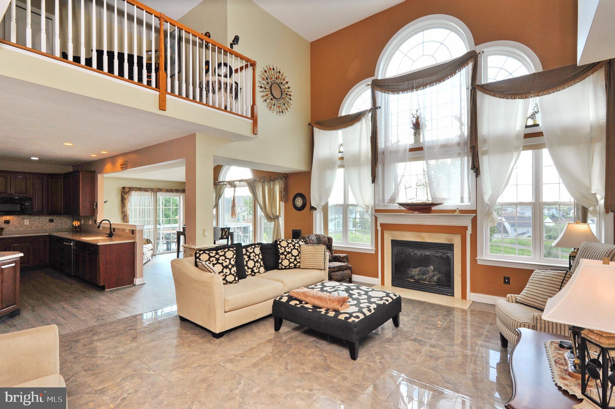 434 Hoffman Road Harleysville, PA 19438 - Photo 19 of 46 a living room with furniture fireplace and a large window