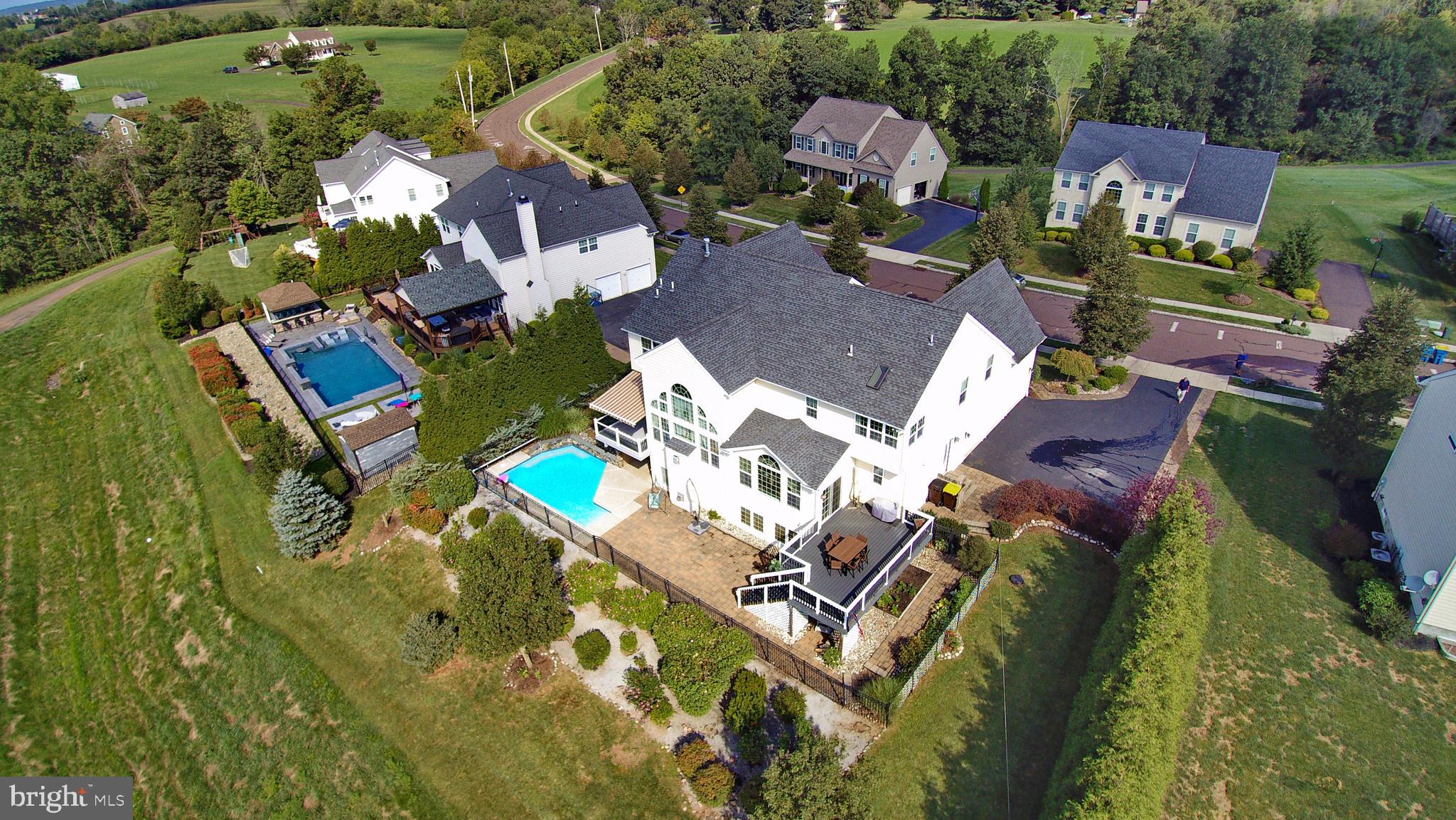 434 Hoffman Road Harleysville, PA 19438 - Photo 3 of 46 an aerial view of a house with a garden and trees