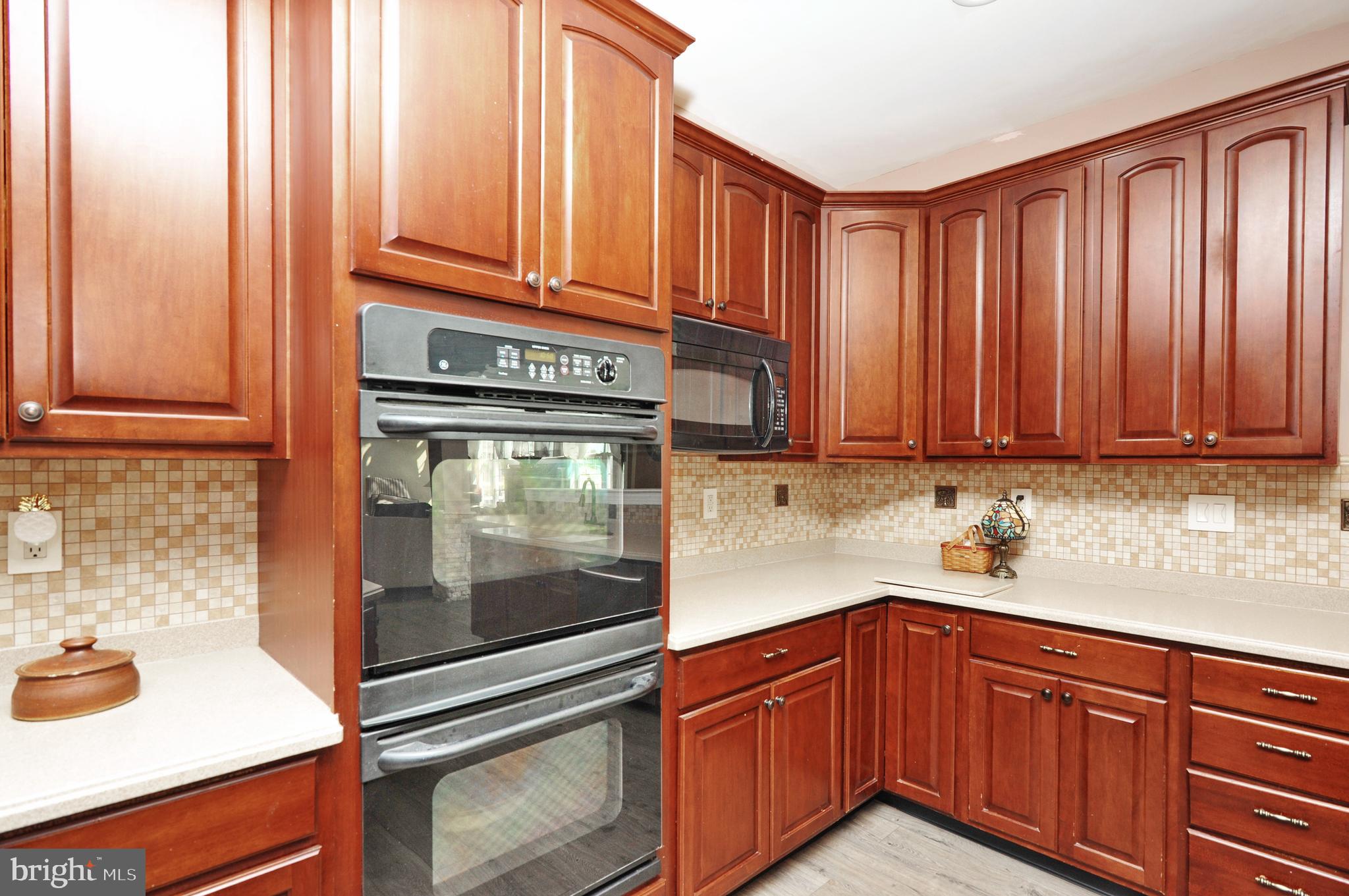 434 Hoffman Road Harleysville, PA 19438 - Photo 23 of 46 a kitchen with stainless steel appliances granite countertop a sink and cabinets