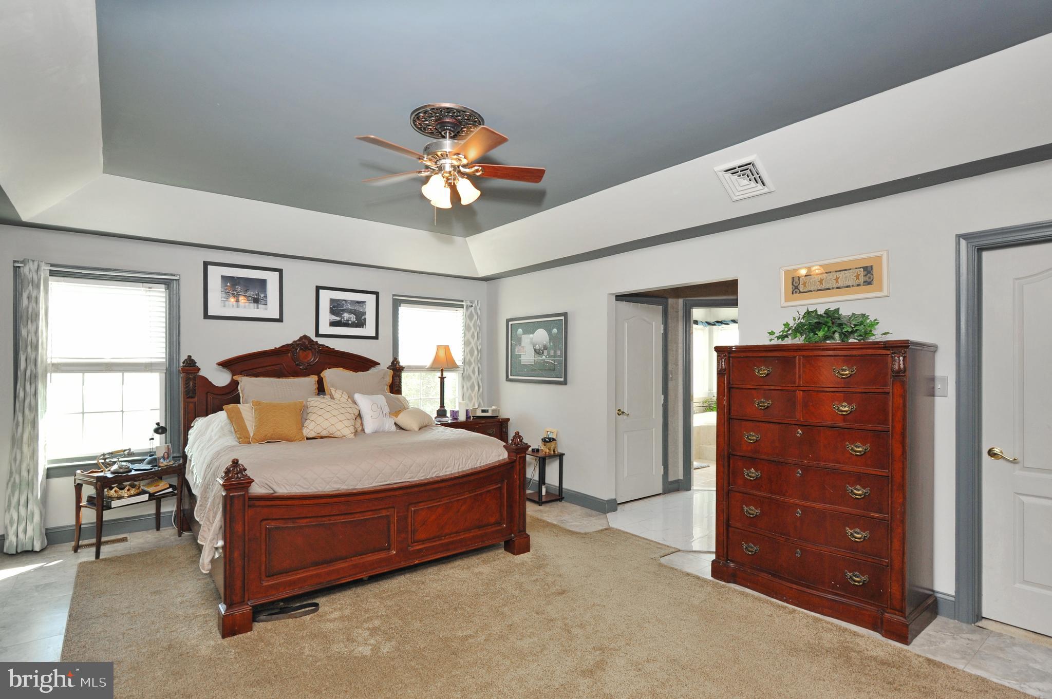 434 Hoffman Road Harleysville, PA 19438 - Photo 28 of 46 a bedroom with a bed and a chandelier