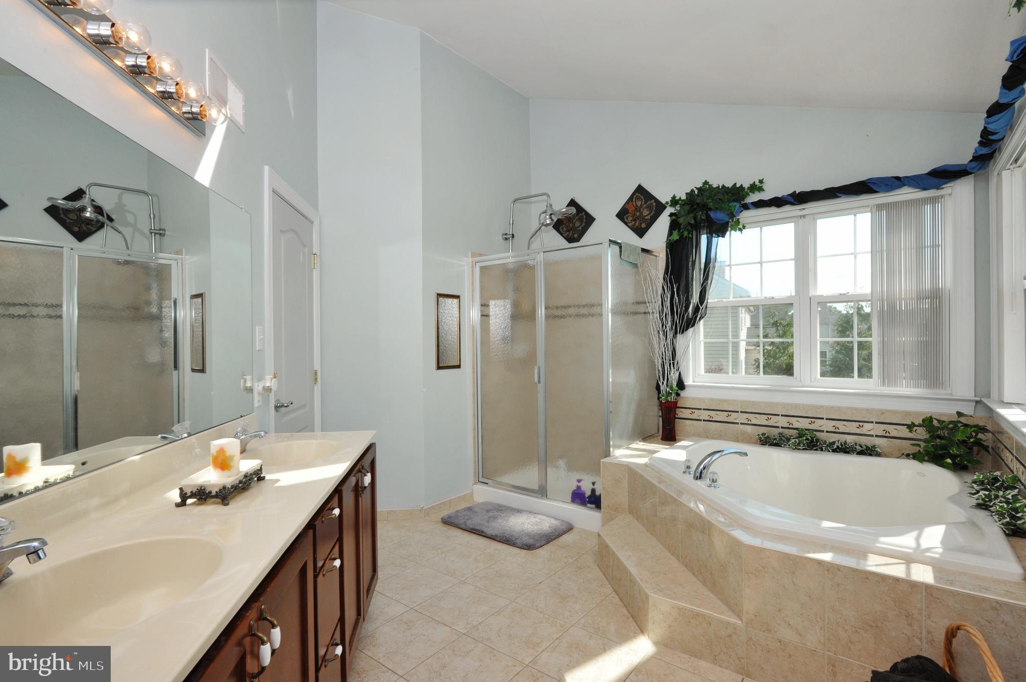 434 Hoffman Road Harleysville, PA 19438 - Photo 33 of 46 a bathroom with a tub sink and mirror