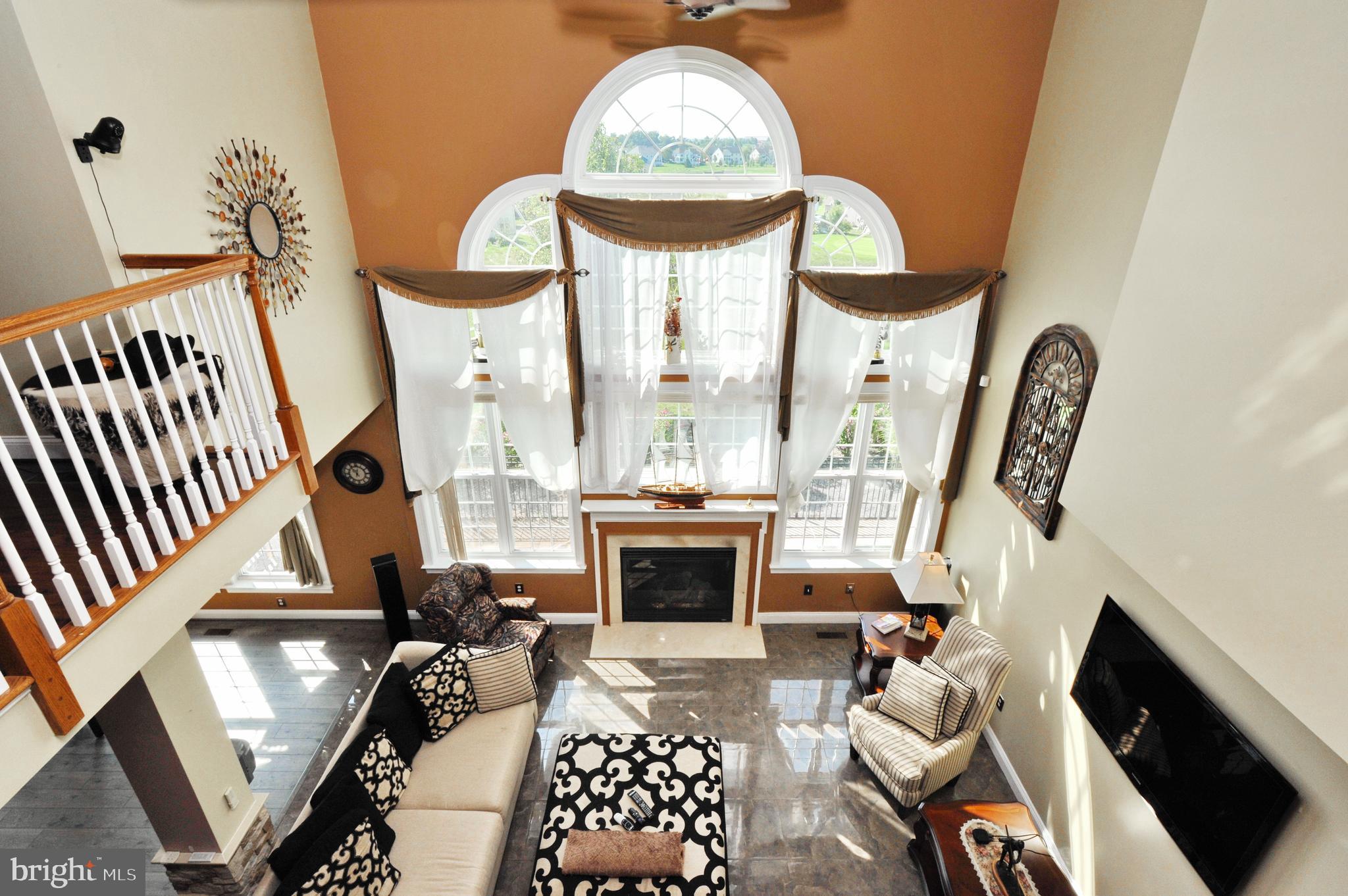 434 Hoffman Road Harleysville, PA 19438 - Photo 37 of 46 a living room with furniture a fireplace and a chandelier
