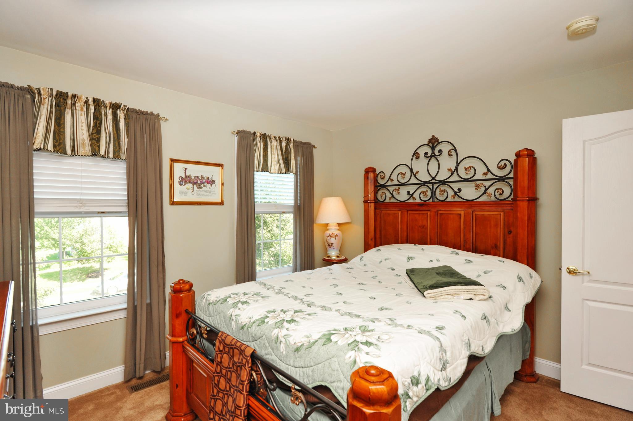 434 Hoffman Road Harleysville, PA 19438 - Photo 39 of 46 a bedroom with a bed and a dresser next to a window