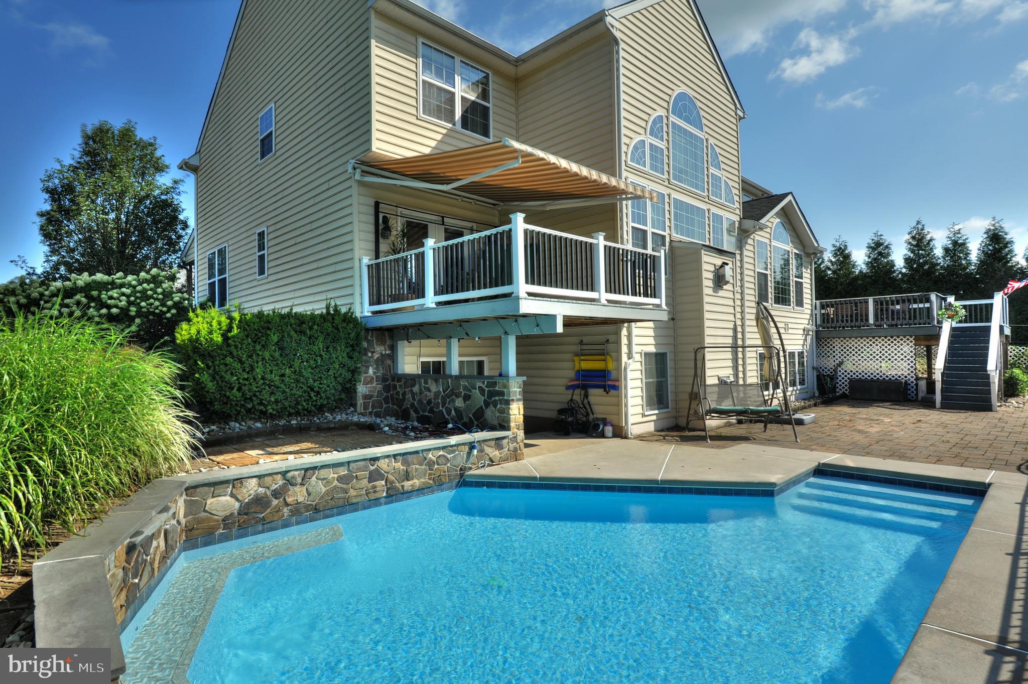 434 Hoffman Road Harleysville, PA 19438 - Photo 8 of 46 a front view of a house with swimming pool