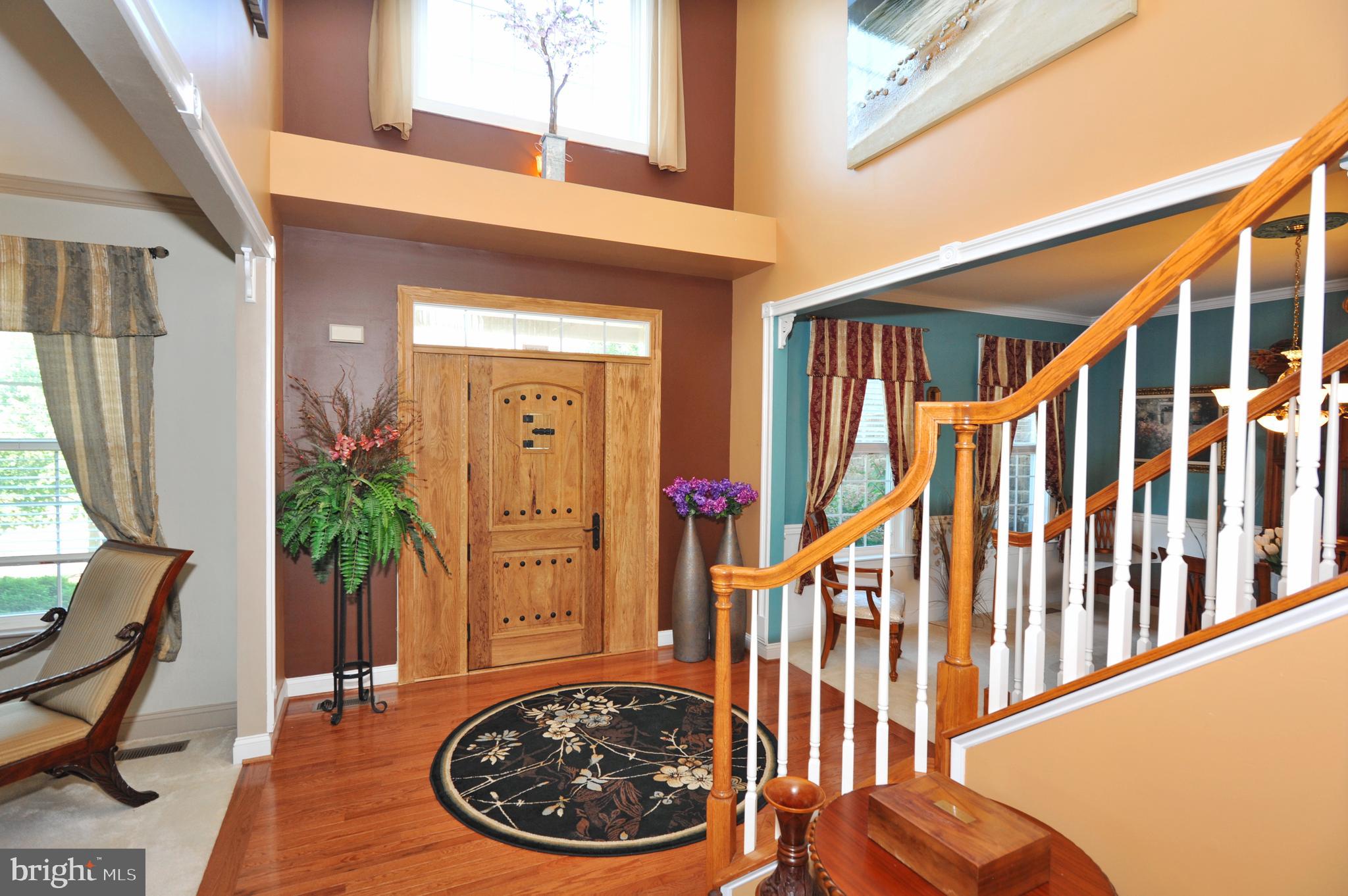 434 Hoffman Road Harleysville, PA 19438 - Photo 9 of 46 a view of a hallway with wooden floor and furniture