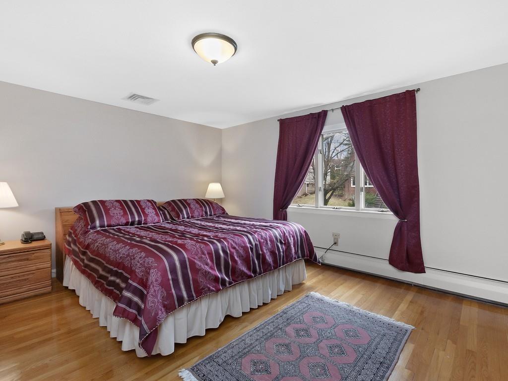 37 Slocum Road Boston, MA 02130 - Photo 12 of 27 a bedroom with a bed and window