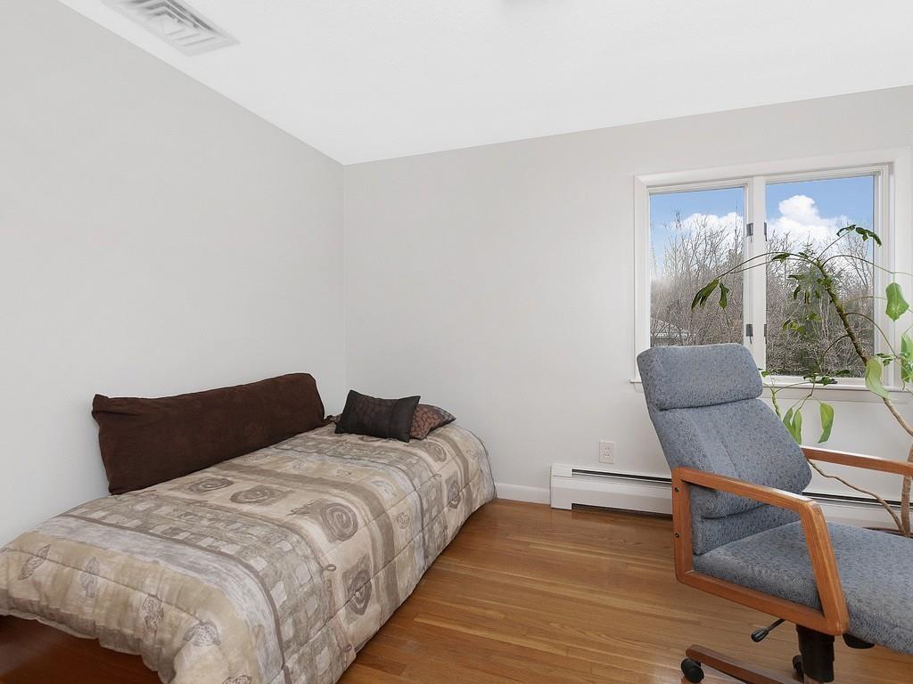 37 Slocum Road Boston, MA 02130 - Photo 14 of 27 a bedroom with two beds and potted plant on the dresser