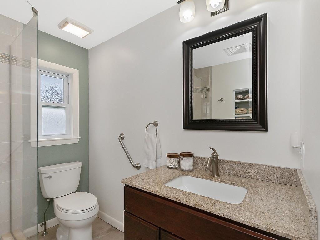 37 Slocum Road Boston, MA 02130 - Photo 17 of 27 a bathroom with a toilet sink and mirror