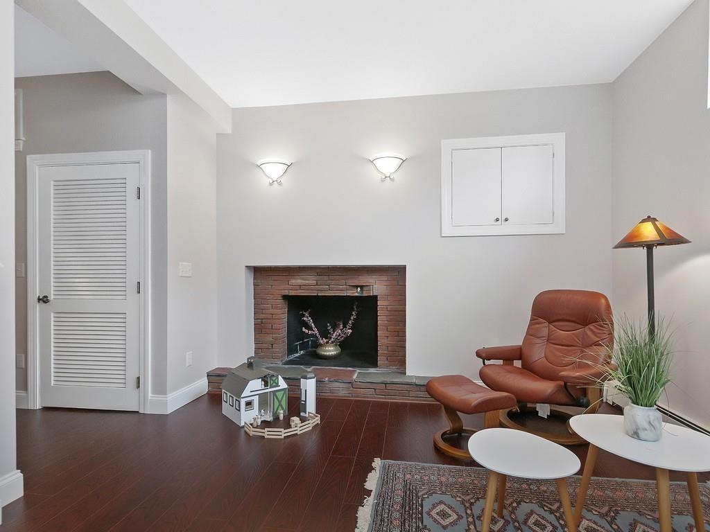 37 Slocum Road Boston, MA 02130 - Photo 18 of 27 a living room with furniture and a fireplace