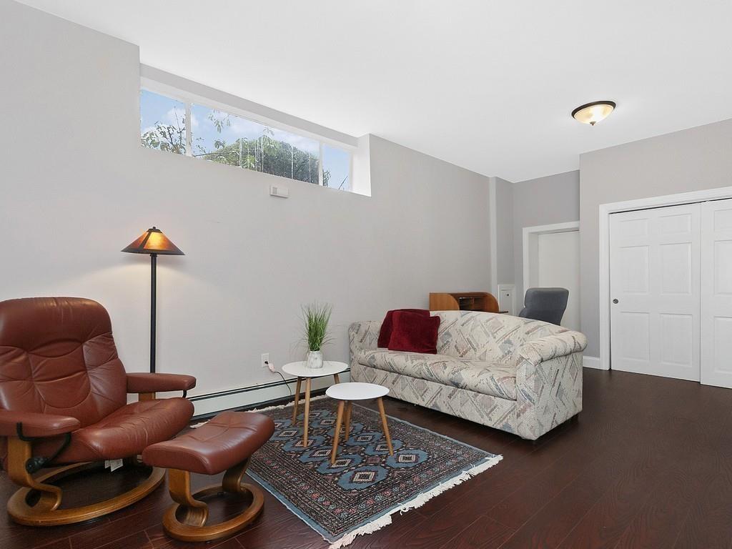 37 Slocum Road Boston, MA 02130 - Photo 19 of 27 a living room with furniture and a rug