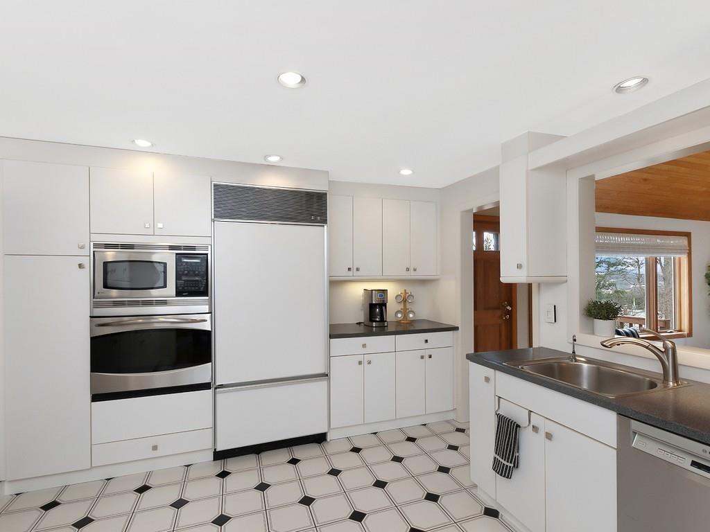 37 Slocum Road Boston, MA 02130 - Photo 9 of 27 a kitchen with granite countertop a white stove top oven and sink