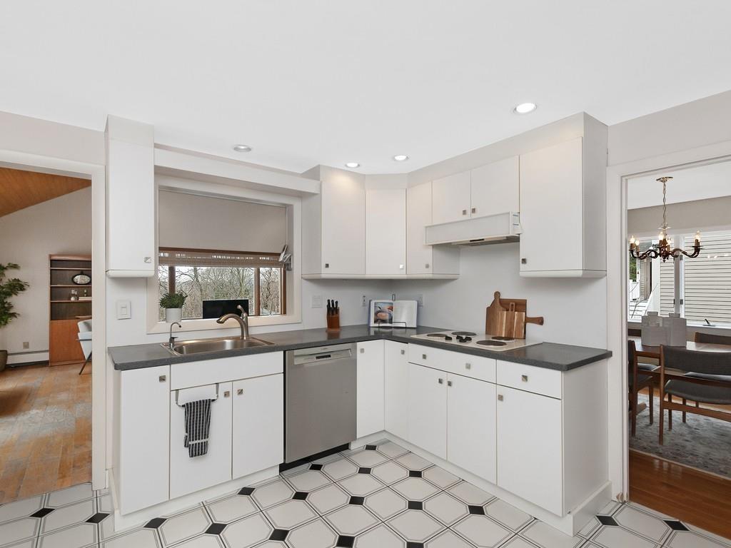 37 Slocum Road Boston, MA 02130 - Photo 10 of 27 a kitchen with a sink stove and cabinets