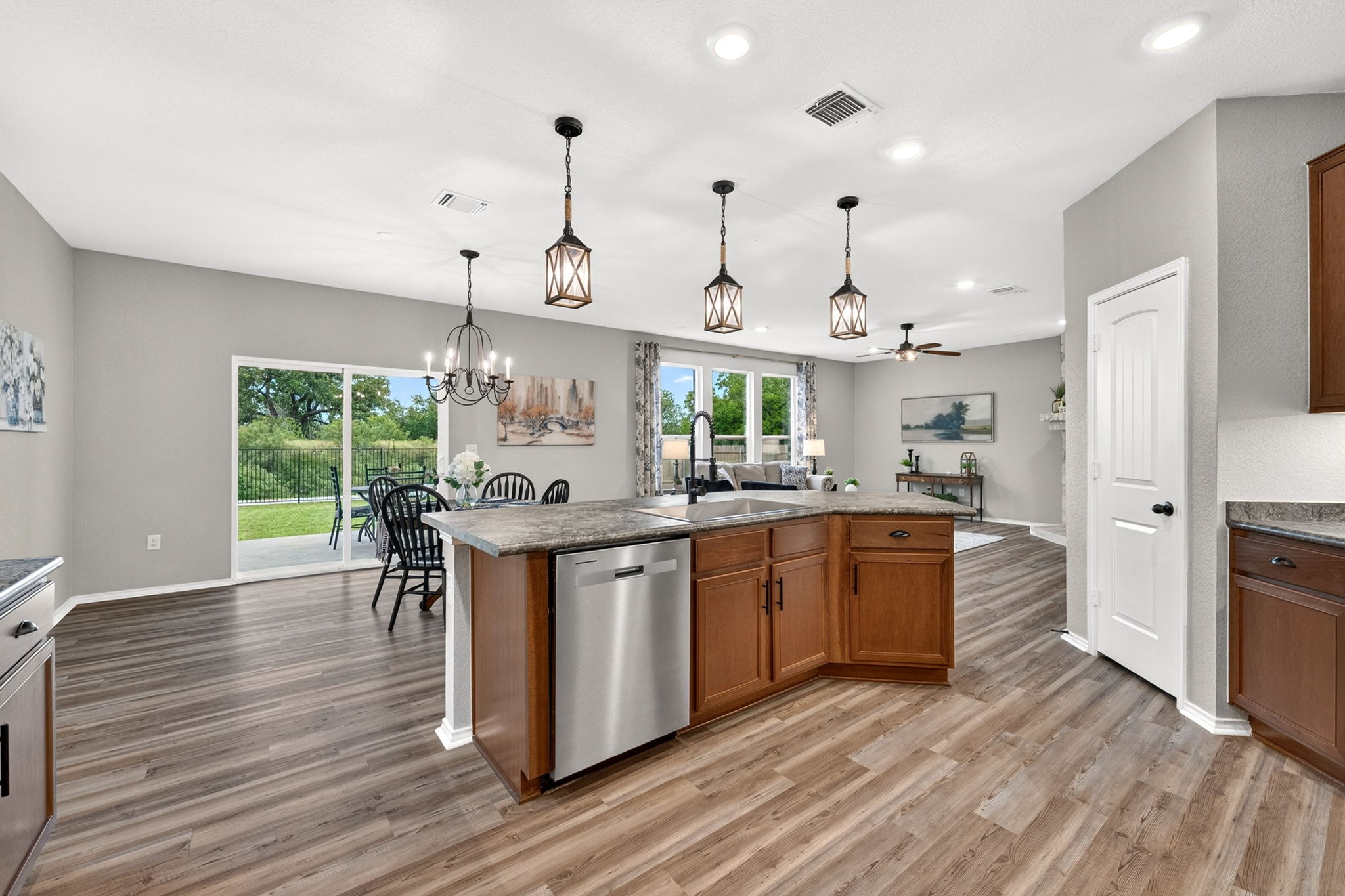 326 Linden Street Bastrop, TX 78602 - Photo 23 of 39 Large kitchen island with a deep single-bowl sink. Beautiful tile backsplash and stainless steel appliances.
