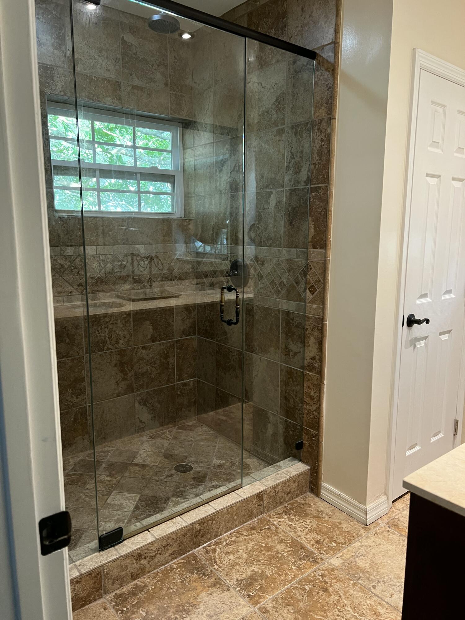 16163 16097 Rustic Road Wellington, FL 33470 - Photo 19 of 36 a bathroom with a shower