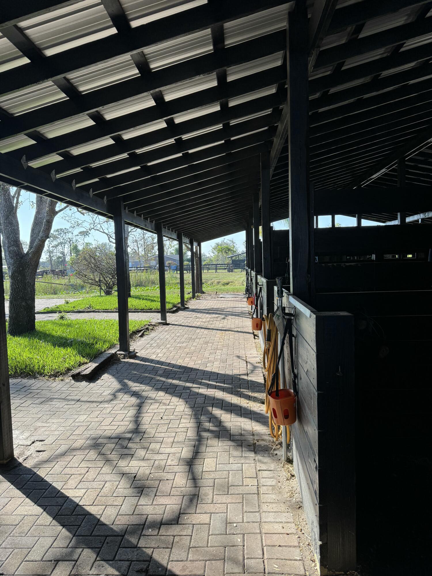 16163 16097 Rustic Road Wellington, FL 33470 - Photo 32 of 36 a view of a porch