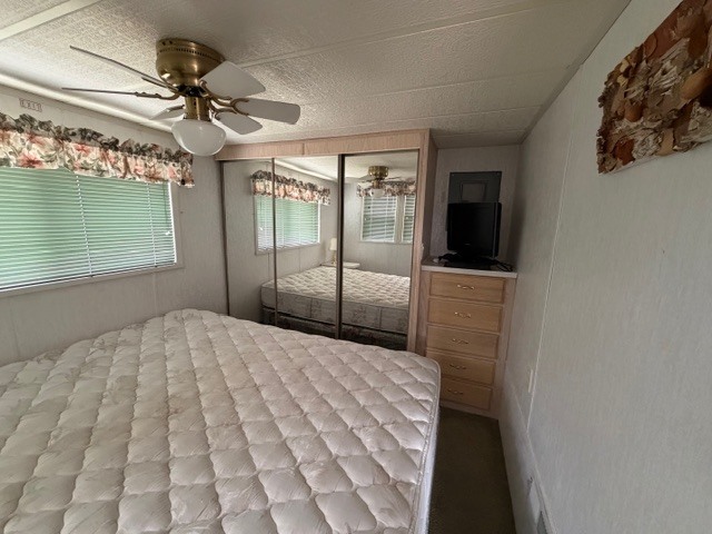 2795 East 28th Road Marseilles, IL 61341 - Photo 18 of 64 a bedroom with a bed and a chandelier