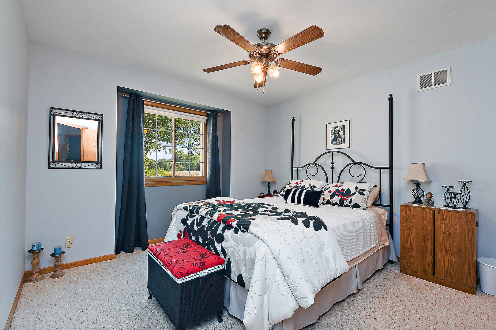 32220 South Cedar Road Manhattan, IL 60442 - Photo 17 of 46 a bedroom with a bed and a chandelier