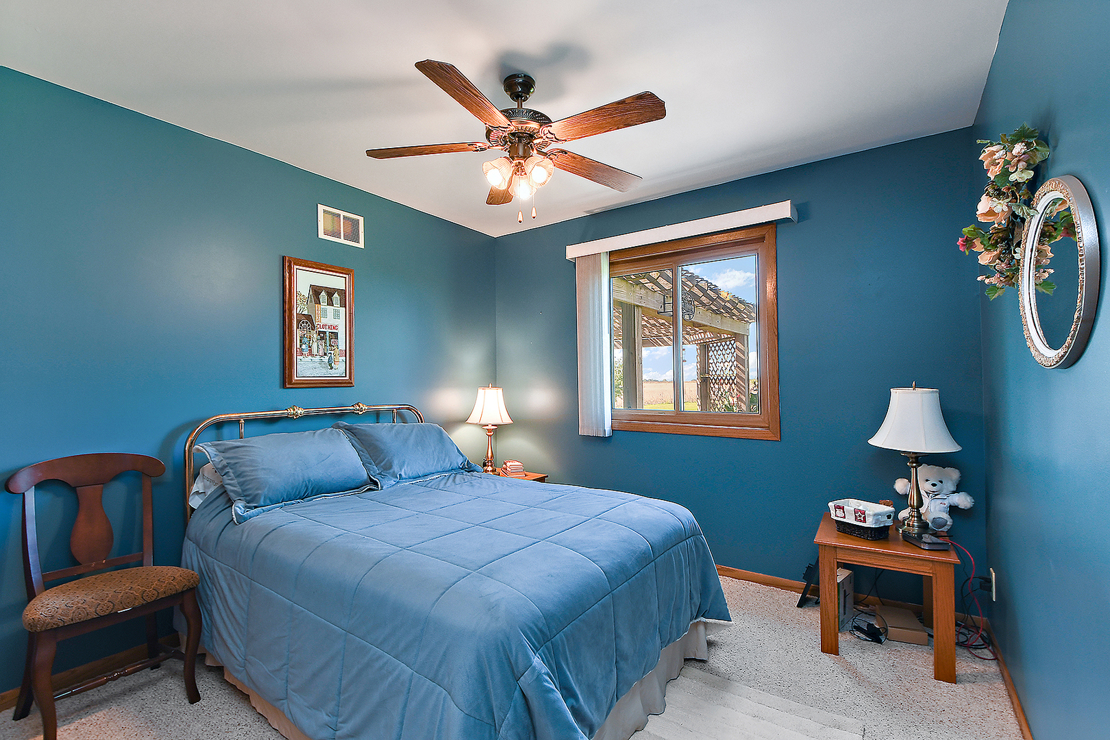 32220 South Cedar Road Manhattan, IL 60442 - Photo 18 of 46 a bedroom with a bed and a chandelier