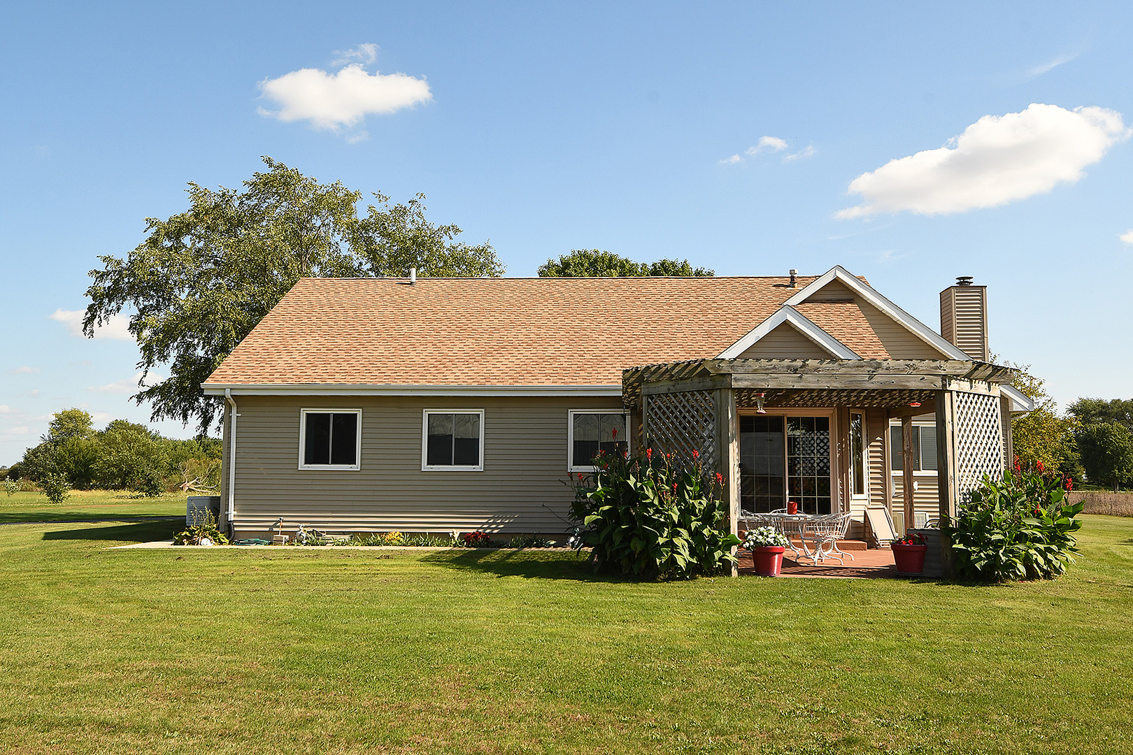 32220 South Cedar Road Manhattan, IL 60442 - Photo 28 of 46 a front view of house with yard and outdoor seating