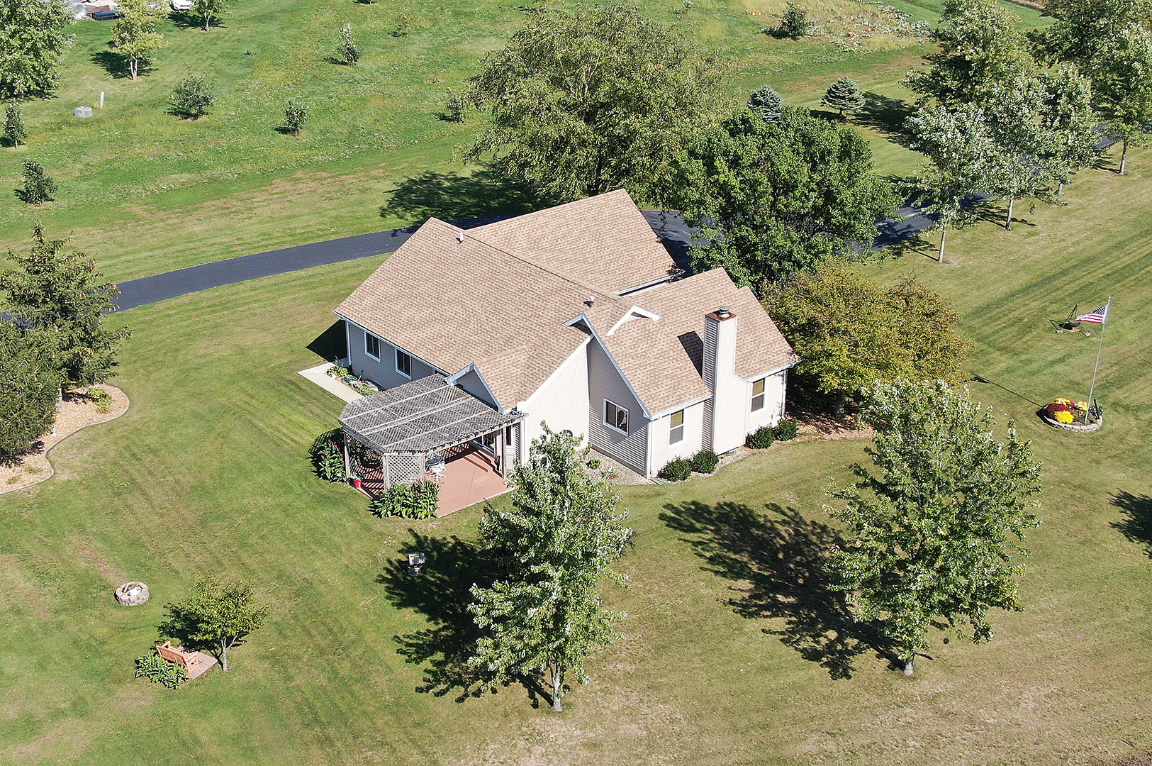 32220 South Cedar Road Manhattan, IL 60442 - Photo 38 of 46 an aerial view of a house with a yard and lake view