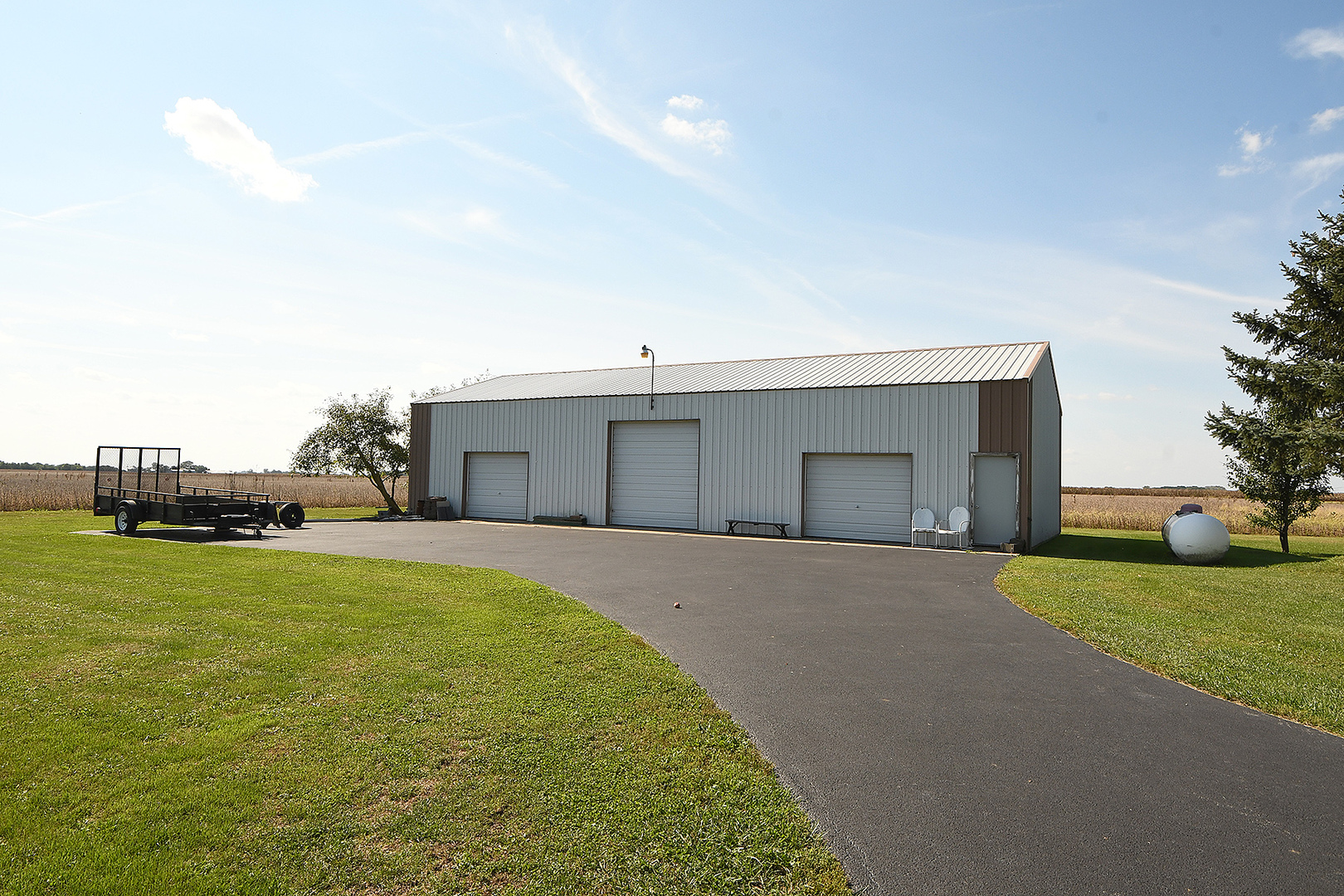 32220 South Cedar Road Manhattan, IL 60442 - Photo 42 of 46 a front view of a house with a yard and garage