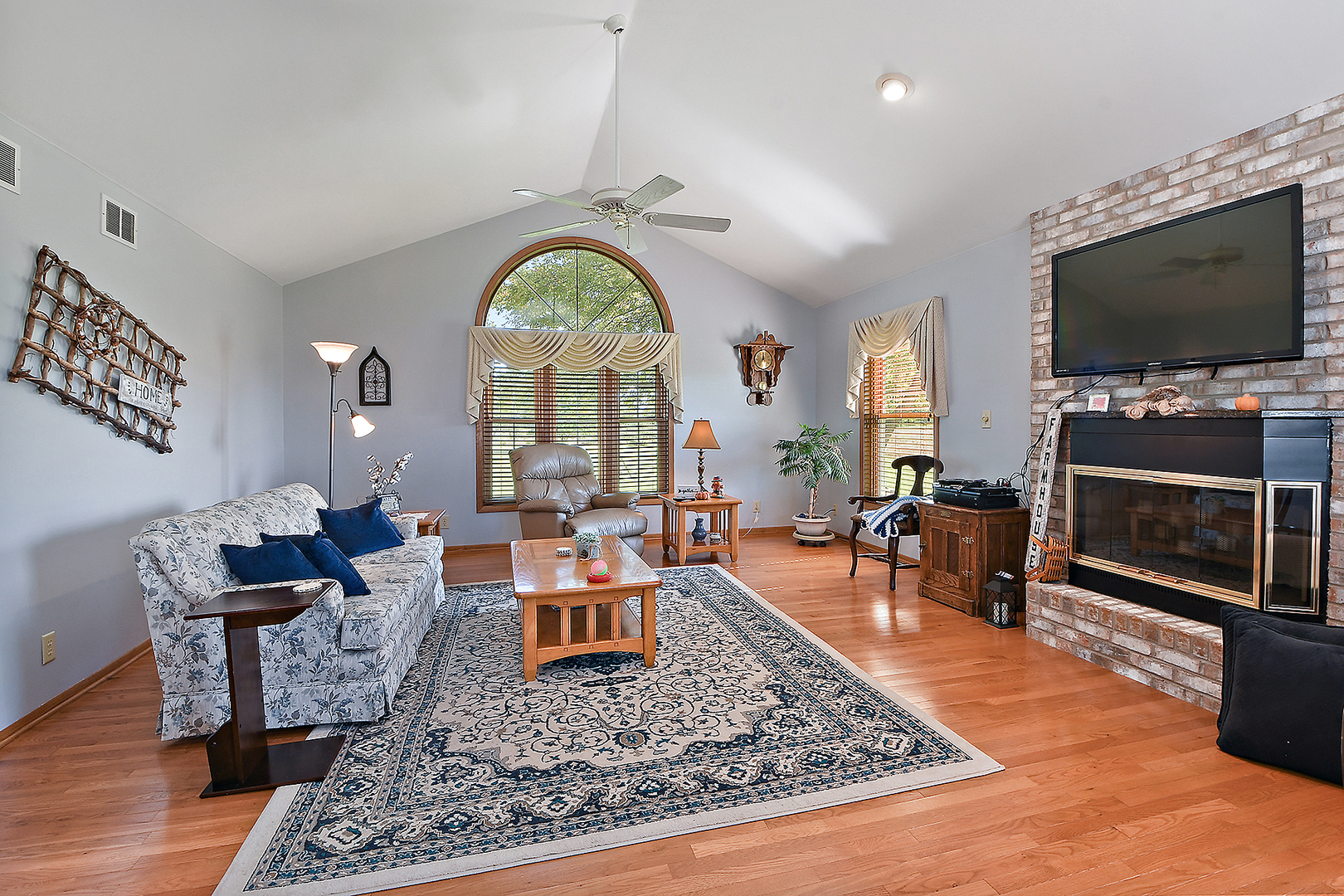 32220 South Cedar Road Manhattan, IL 60442 - Photo 6 of 46 a living room with furniture a rug and a flat screen tv