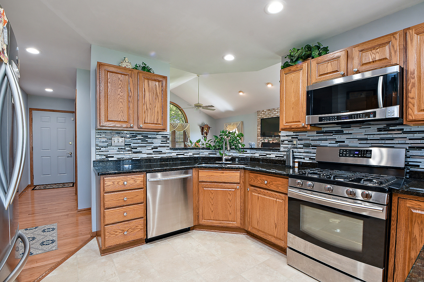 32220 South Cedar Road Manhattan, IL 60442 - Photo 8 of 46 a kitchen with stainless steel appliances a stove sink and microwave