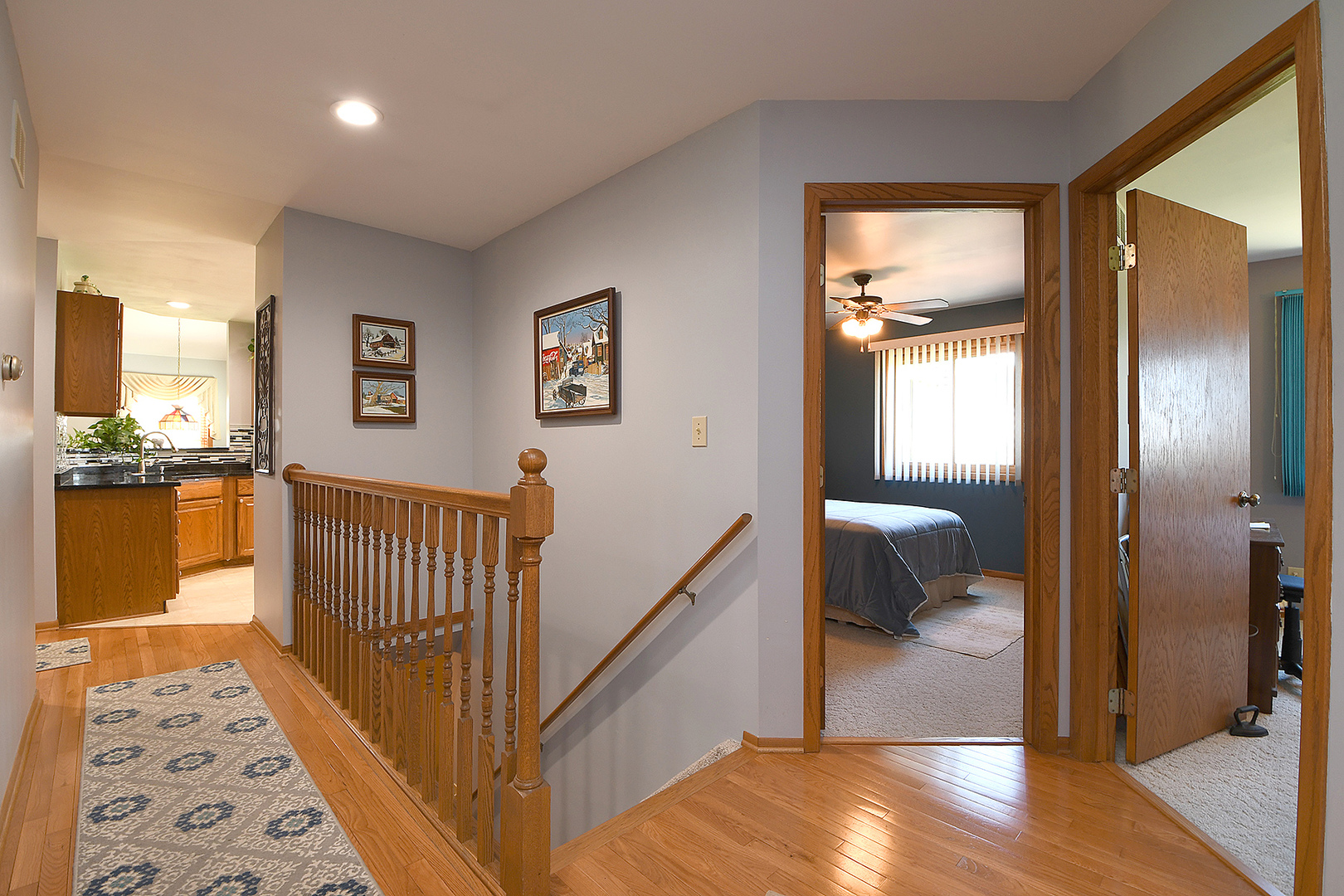 32220 South Cedar Road Manhattan, IL 60442 - Photo 10 of 46 a view of a hallway with wooden floor and a bathroom