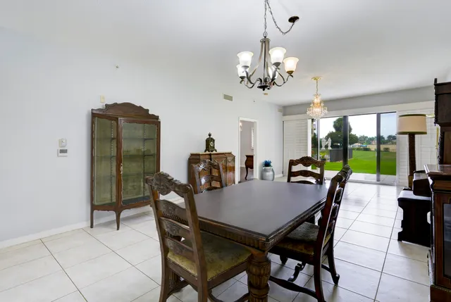 a kitchen with furniture a stove and a clock