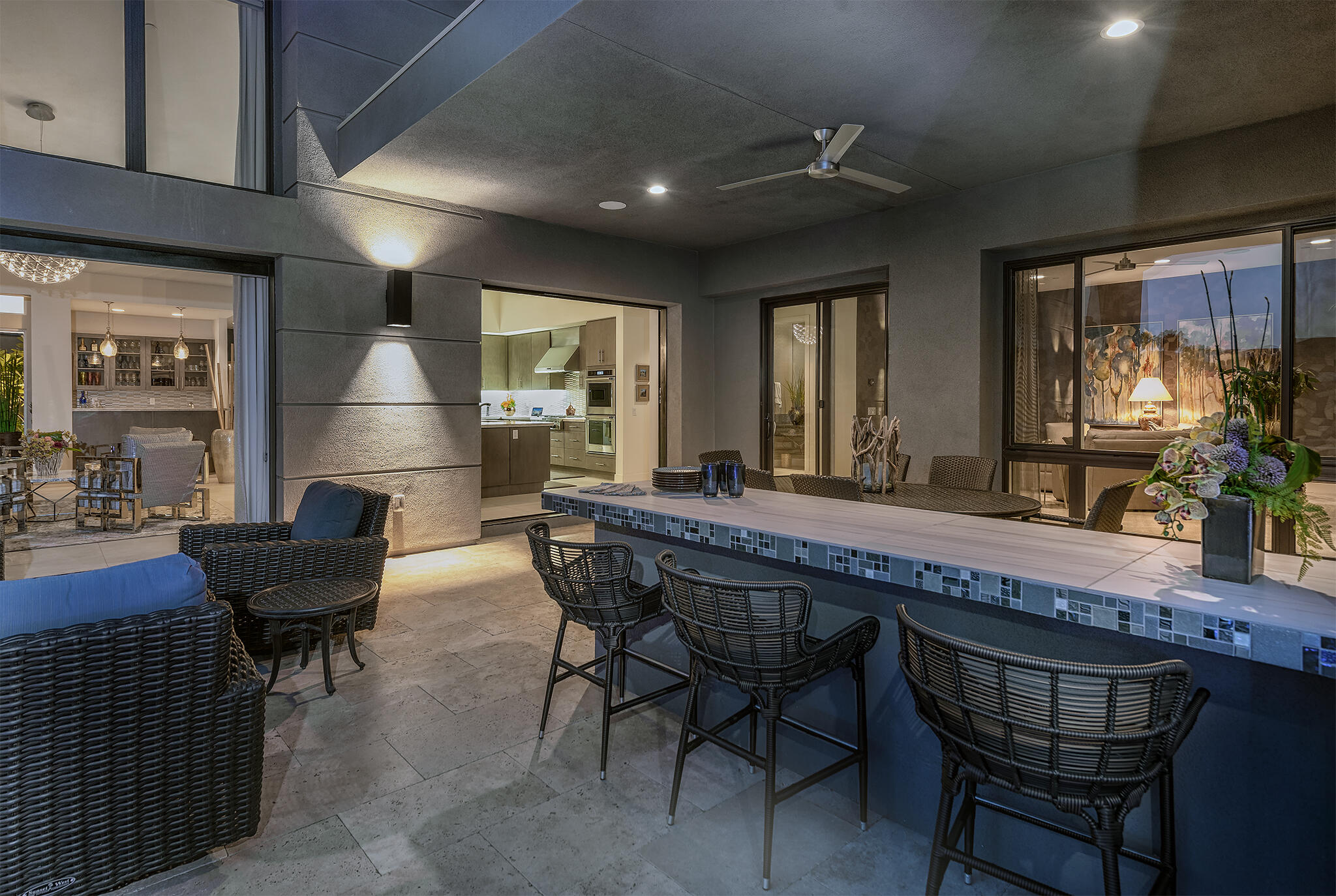 1 Via Merenda Rancho Mirage, CA 92270 - Photo 13 of 29 a dining room with furniture a floor to ceiling window and potted plants