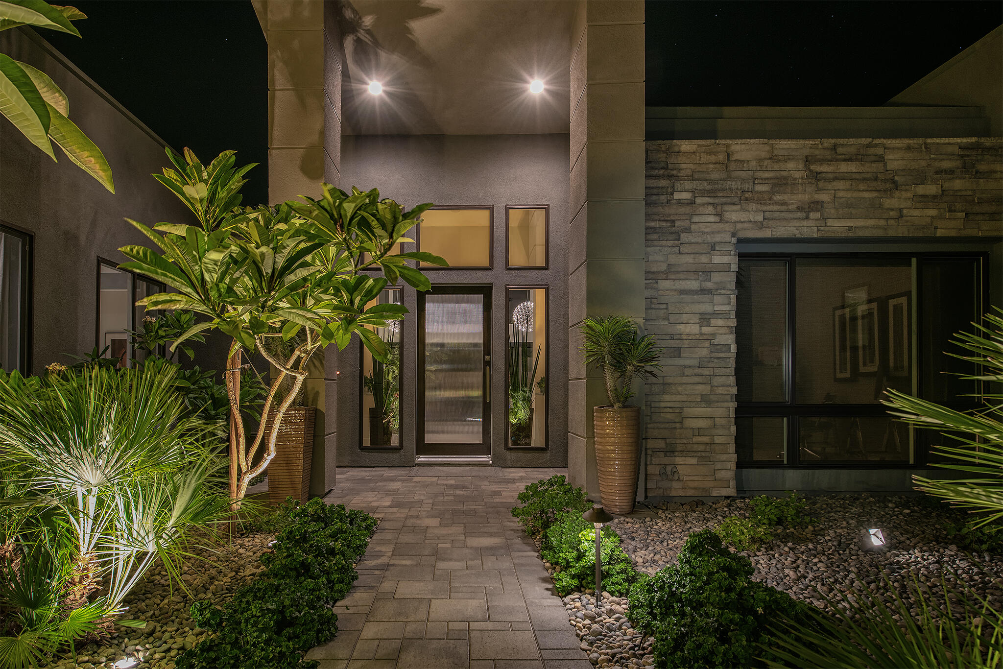 1 Via Merenda Rancho Mirage, CA 92270 - Photo 27 of 29 a view of a entryway door with flower in front of house