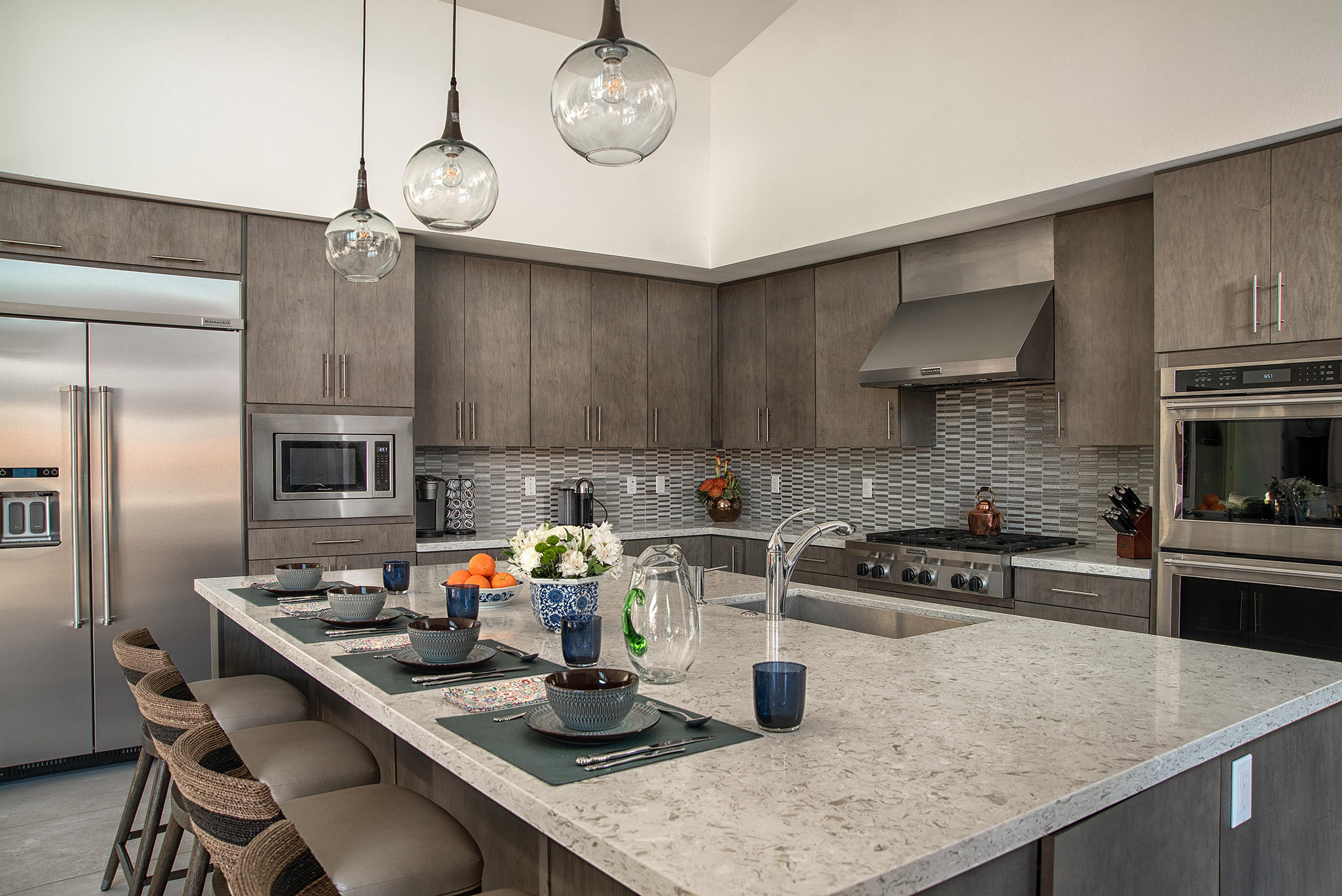 1 Via Merenda Rancho Mirage, CA 92270 - Photo 6 of 29 a kitchen with a sink a stove and chairs