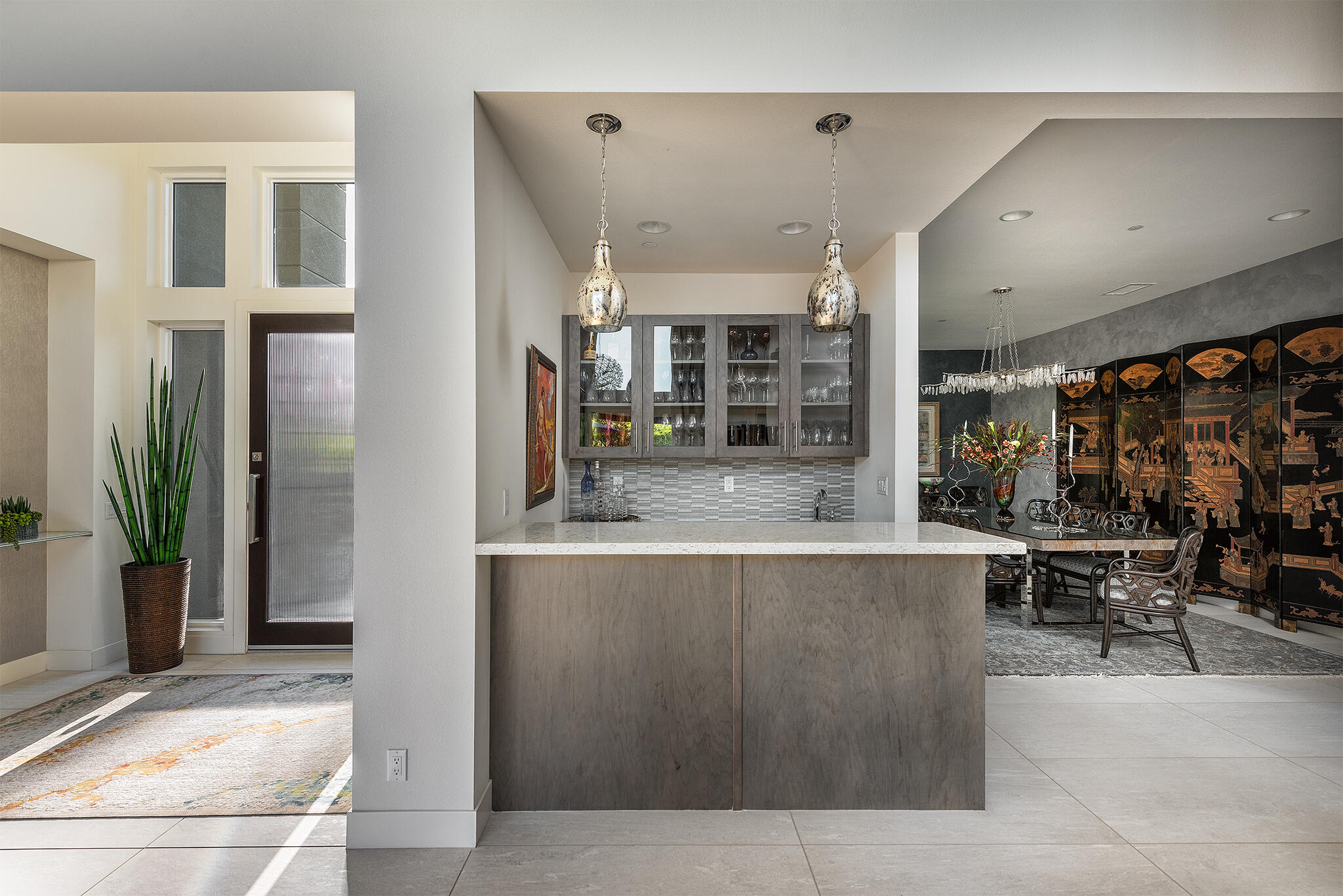 1 Via Merenda Rancho Mirage, CA 92270 - Photo 9 of 29 a large kitchen with stainless steel appliances kitchen island a large counter top and chairs