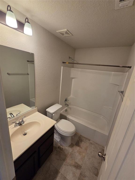 7504 Boat Wind Road Fort Worth, TX 76179 - Photo 5 of 17 a bathroom with a sink a toilet and shower