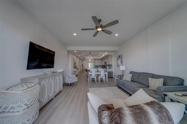 a bedroom with bed and a tv on dresser