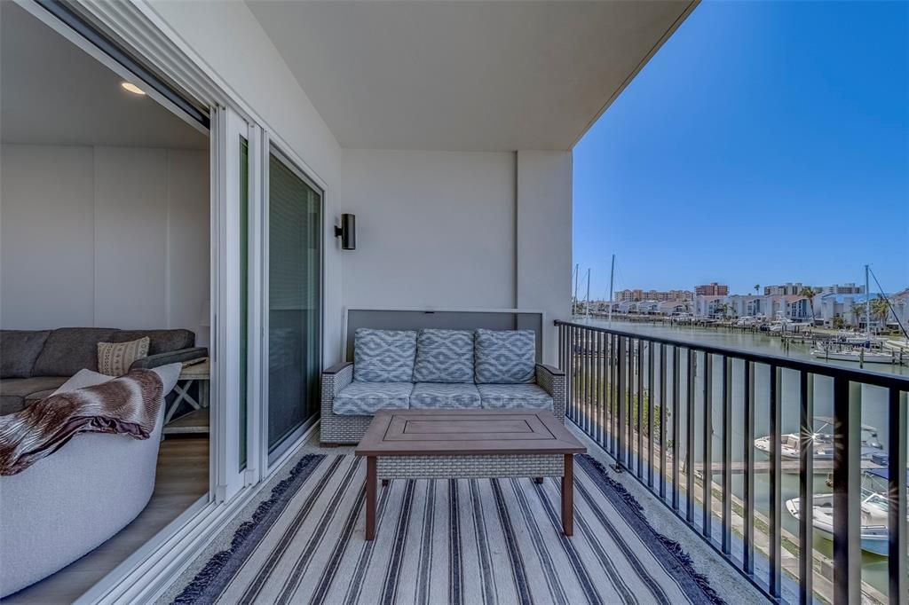 400 150th Avenue, Unit 301 Madeira Beach, FL 33708 - Photo 29 of 66 a view of a balcony with furniture